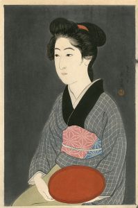 盆持てる女